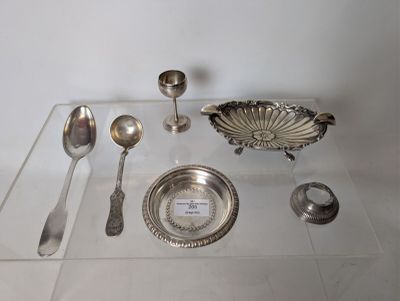 a glass table with silverware and spoons on it