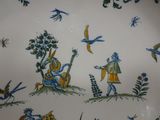 a plate with a picture of people and birds on it