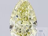 un diamant jaune en forme de poire monté sur un socle noir