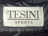 the back of a black jacket with a name tag on it