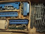 a box with a bunch of toy trains inside of it