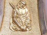 a statue of a man holding a baseball bat on top of a table