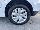 a close up of a tire on a white car