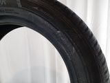 a close up of a tire on a white surface with a white background