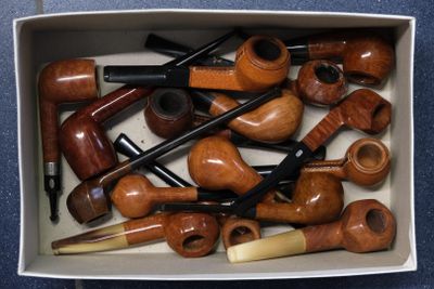 a box full of different types of pipe smokings
