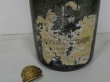 a bottle of wine that has a bell on it