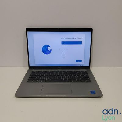 an open laptop computer sitting on top of a white table