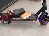 a scooter with a box on the back of it