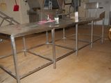 an image of a kitchen with a table in the middle of it