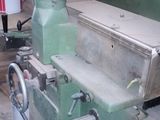 an image of a machine that is working on a piece of wood
