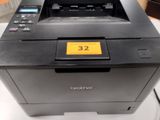 a printer that is sitting on top of a table