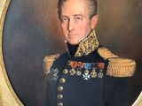 portrait of a man in a military uniform in a gold frame