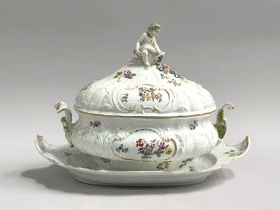 a picture of a fancy tureeny dish with a monkey on top