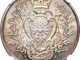 an image of a silver coin with a coat of arms on it
