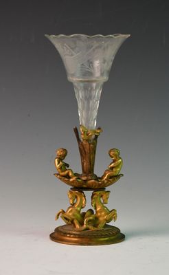 a glass vase that is sitting on a stand