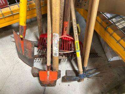 a pile of tools sitting on the floor next to each other