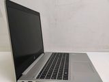 a laptop that is sitting on a white table