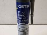 a close up of a bottle of fix and fix glue on a table