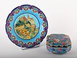 a plate and a box sitting next to each other on a table