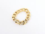 a close up of a gold chain bracelet on a white surface