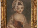 un tableau représentant une jeune fille portant un turban, dans un cadre doré