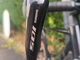 a close up of a bike handle with a blurry background