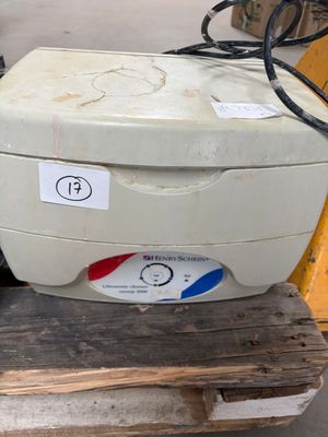 a white box sitting on top of a pallet in a warehouse