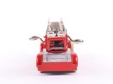 a red toy fire truck with a ladder on top of it