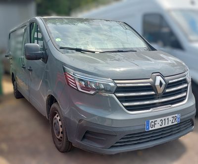 a grey van that is parked on the side of the road