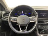 the interior of a car with a steering wheel and dashboard controls