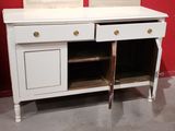 a white cabinet with a mirror on top of it