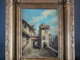 an old painting of a street scene in a gold frame on a red surface