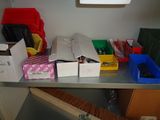 many boxes on a metal shelf in a room