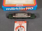 a box of marklin ho trains next to a box of service