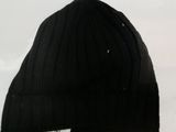 a black hat that is sitting in the snow
