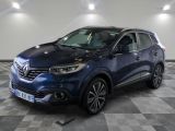 the blue renault kad suv is parked in a large room