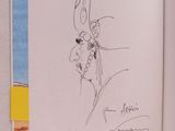un livre ouvert dont la couverture est ornée d'un dessin représentant un lapin