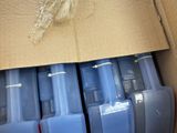 six blue plastic containers in a cardboard box