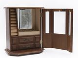 an image of a wooden jewelry cabinet with a mirror and drawers