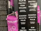 three boxes of sun protection film sitting on top of each other