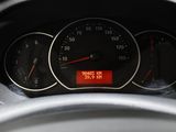 a close up of a car dashboard with a speedometer and gauges