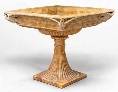 un socle ancien en bois surmonté d'un bol
