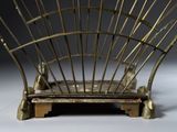 a sculpture of a chair made out of metal rods