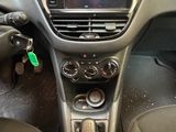 the interior of a car with a steering wheel and dashboard controls