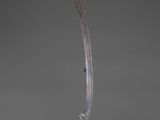 an image of a glass sculpture of a long blade