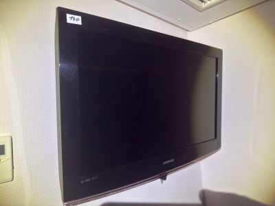 a flat screen tv mounted on a wall in a room