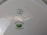 a plate with a crown on it sitting on a table
