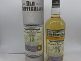 une bouteille de whisky écossais « Old Particular » posée à côté d'un carton