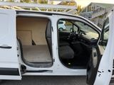 a white van with its doors open in a parking lot