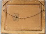 an old wooden picture frame with a picture of a man on it